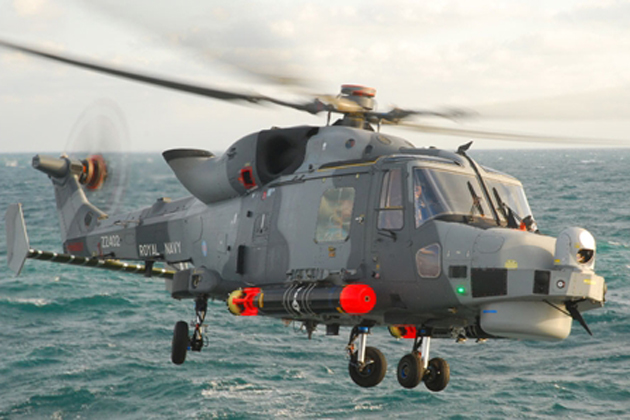 Royal Navy Wildcat helicopter lands on HMS Dragon