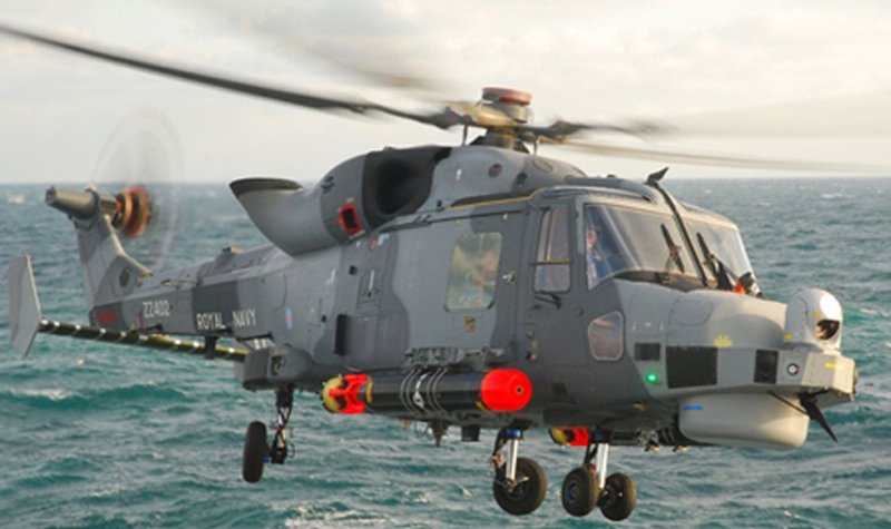 Royal Navy Wildcat helicopter lands on HMS Dragon
