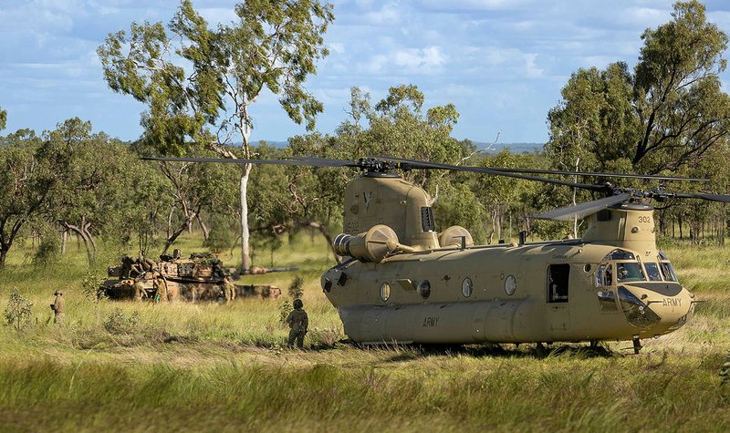 Australian soldiers practise Abrams tank refuelling with Chinook helicopter