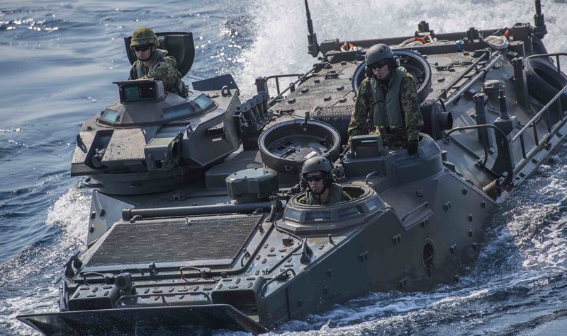 With eye on China, Japan unveils record defence budget