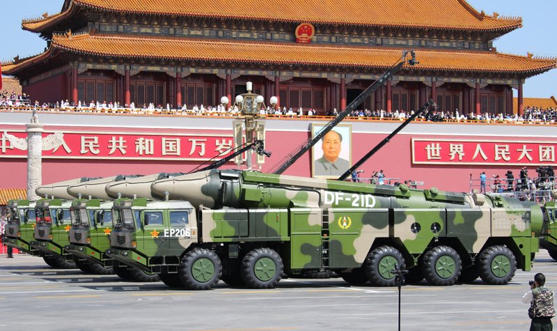 Insight: China ups the ante by firing missiles into troubled waters