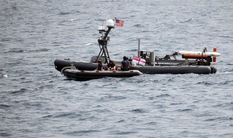 HMS Bangor receives supplies from USV in RN first