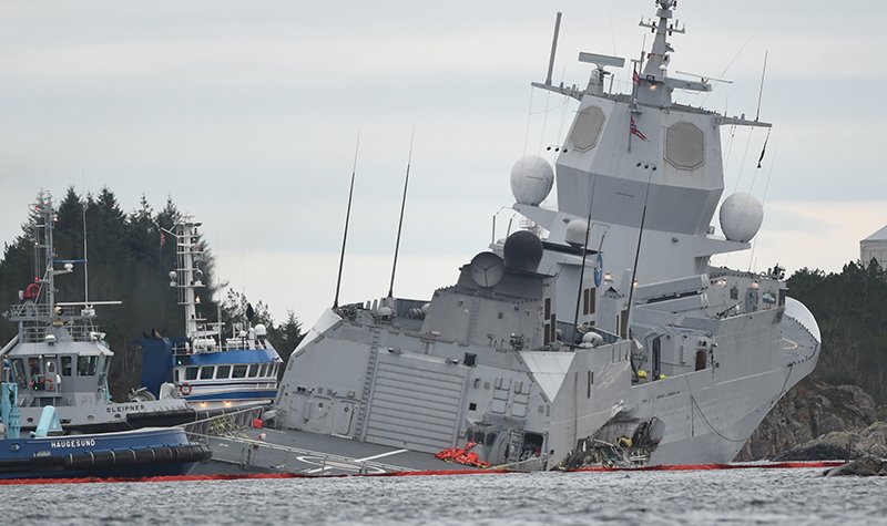 Race to stop Norway frigate sinking after oil tanker collision